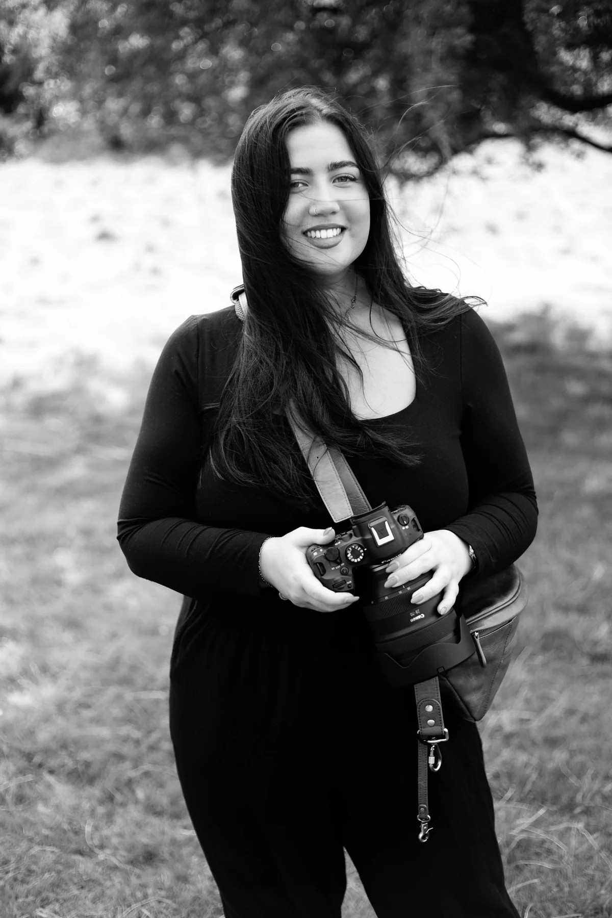 Bethan Kate, photographer, holding her camera