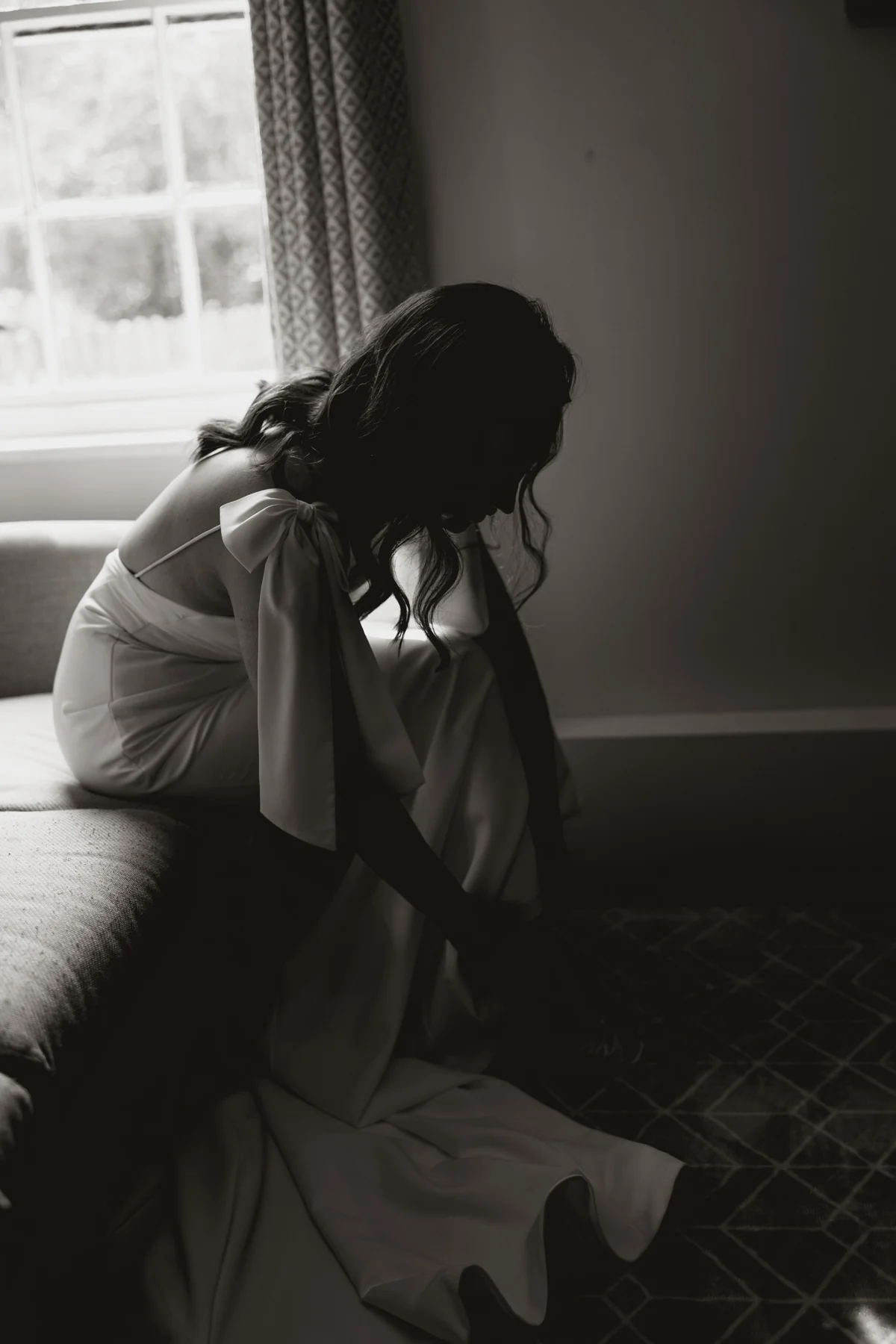 A bride in a quiet moment before the ceremony